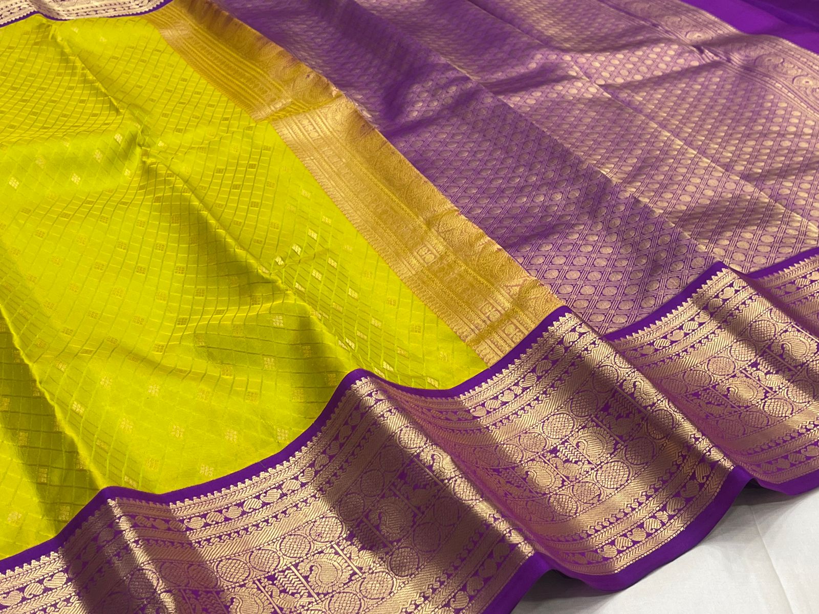 Rani Pink Kanjivaram Silk Saree with a Contrast Purple Zari Border.